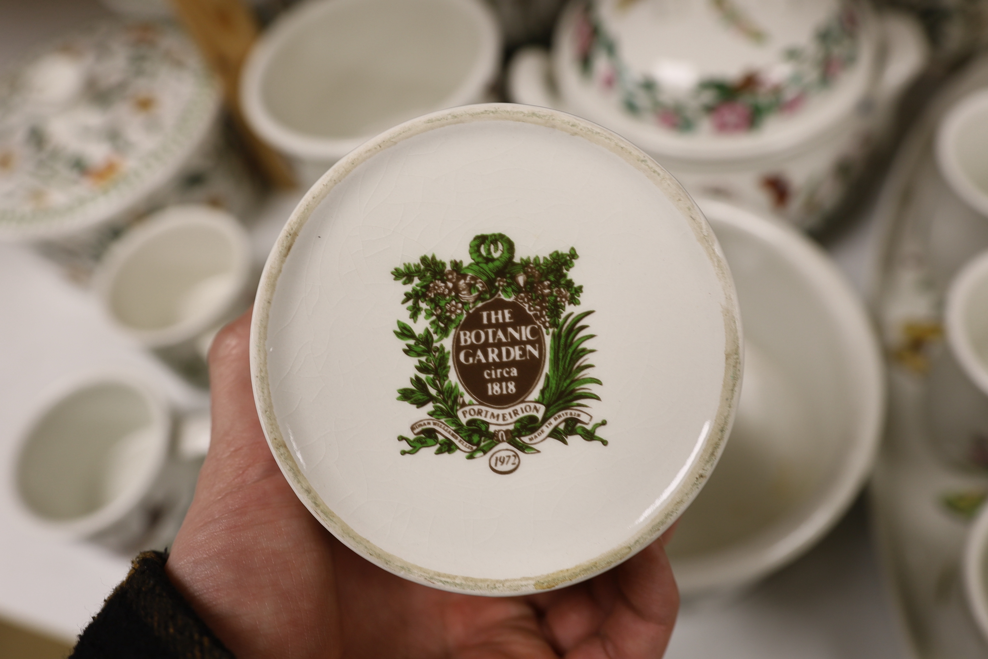 A Royal Worcester Evesham part dinner service, together with Portmeirion items including eight mugs, three lidded tureens, etc.